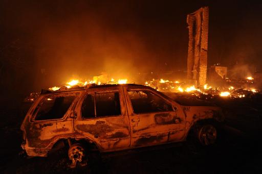 Verbranntes Auto und Überreste eines Hauses in der Nähe von Bastrop, Texas (5. September)