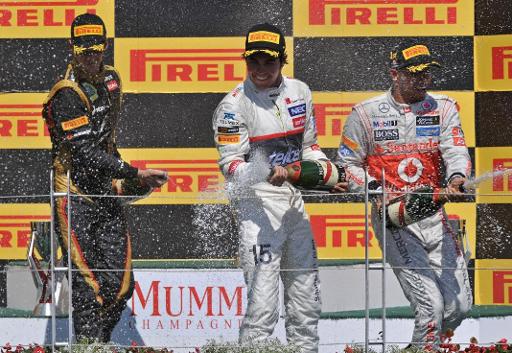 Romain Grosjean, Sergio Perez Mendoza und Louis Hamilton feiern nach dem Grand Prix in Montréal