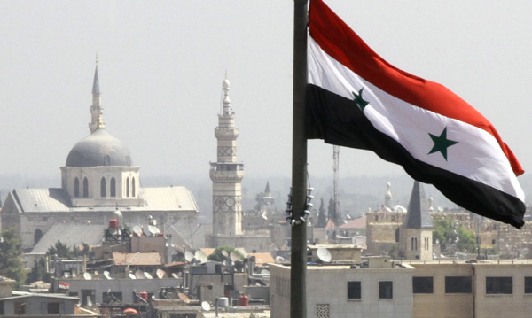 Syrische Flagge über Damaskus (Archivbild: Louai Beshara/EPA)