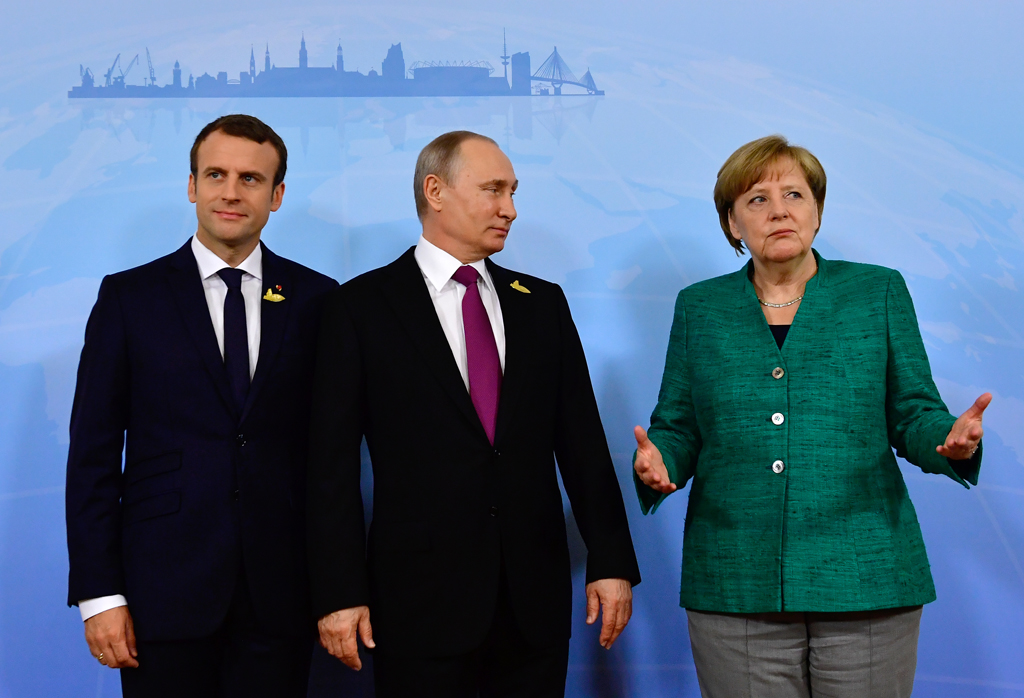Macron, Putin, Merkel (v.l.n.r.)
