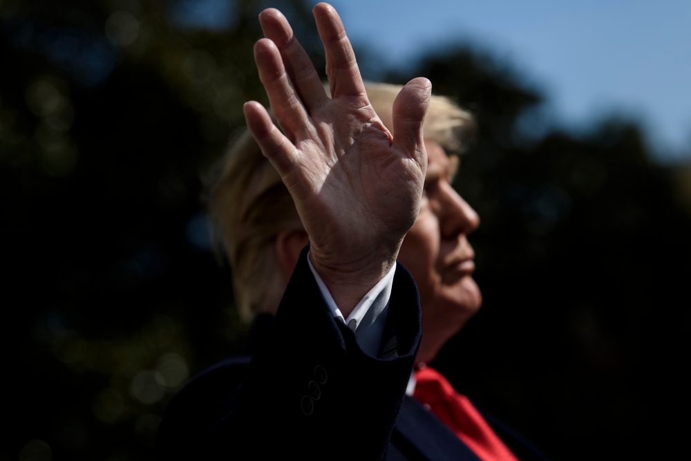 US President Donald Trump speaks to reporters before walking to Marine One on the South Lawn of the White House November 29, 2018 in Washington, DC. - Trump said Thursday his ex-lawyer Michael Cohen was a "weak person" who was lying to get a reduced sentence after the fixer admitted misleading Congress over the Russia investigation. (Photo by Brendan Smialowski / AFP)