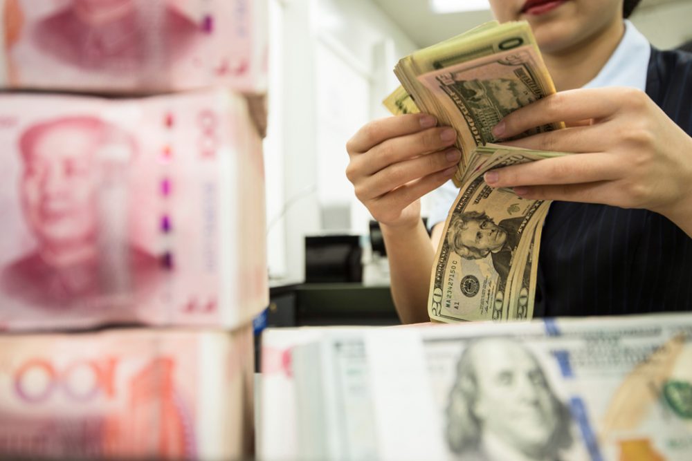 Yuan und Dollar (Bild: STR/AFP)