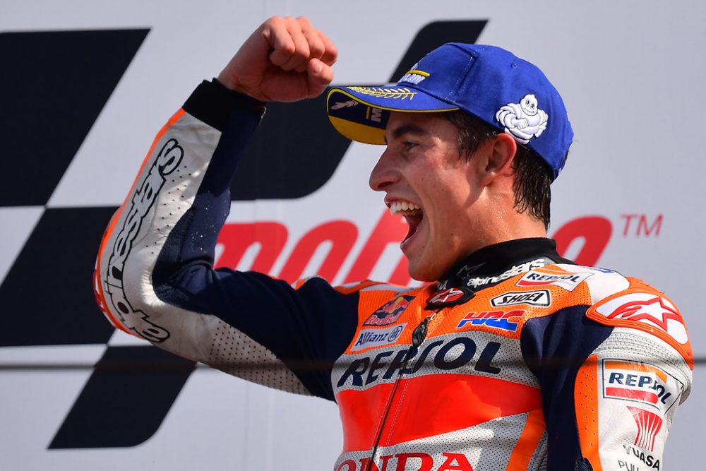 Race winner Repsol Honda Team Spanish rider, Marc Marquez celebrates on the podium following the San Marino MotoGP Grand Prix race at the Misano World Circuit Marco Simoncelli on September 15, 2019. (Photo by Marco Bertorello / AFP)