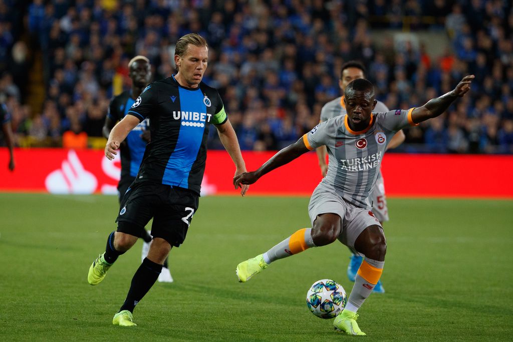 Club's Ruud Vormer and Galatasaray's Jean Michael Seri fight for the ball during a game between Belgian soccer team Club Brugge and Turkish club Galatasaray AS, in Brugge, Wednesday 18 September 2019, on the first day of the group stage of the UEFA Champions League, in the group A. BELGA PHOTO KURT DESPLENTER