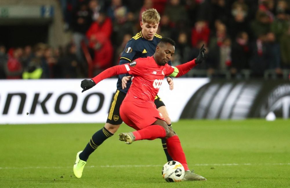 Arsenal's Emile Smith Rowe and Standard's Paul-Jose Mpoku Ebunge fight for the ball during a soccer match of Belgian team Standard de Liege against English club Arsenal F.C., Thursday 12 December 2019 in Liege, on the sixth and last day of the group stage of the UEFA Europa League, in group F. BELGA PHOTO VIRGINIE LEFOUR