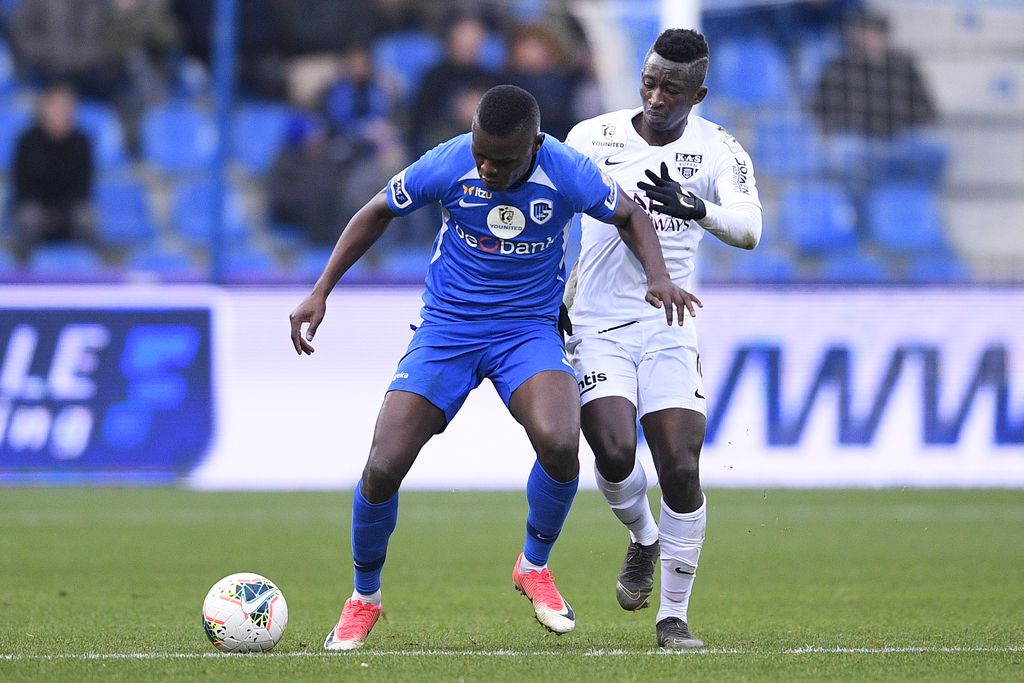 Genk's Aly Mbwana Samatta and Eupen's Lazare Armani fight for the ball during a soccer match between KRC Genk and KAS Eupen, Thursday 26 December 2019 in Genk, on day 21 of the 'Jupiler Pro League' Belgian soccer championship season 2019-2020. BELGA PHOTO YORICK JANSENS