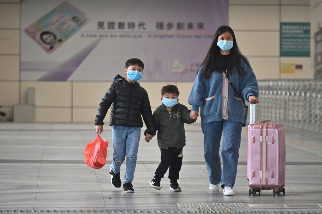 Coronavirus: Chinesen mit Mundschutz in Wuhan (Archivbild: Philip Fong/AFP)