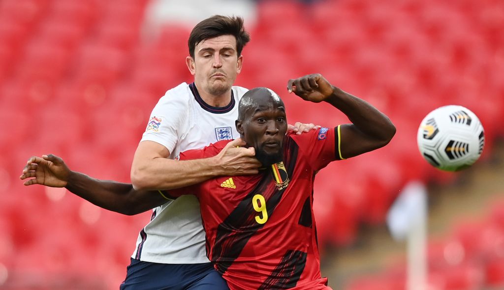 ngland's defender Harry Maguire (L) challenges Belgium's striker Romelu Lukaku during the UEFA Nations League group A2 football match between England and Belgium at Wembley stadium in north London on October 11, 2020. (Photo by Michael Regan / POOL / AFP) / NOT FOR MARKETING OR ADVERTISING USE / RESTRICTED TO EDITORIAL USE