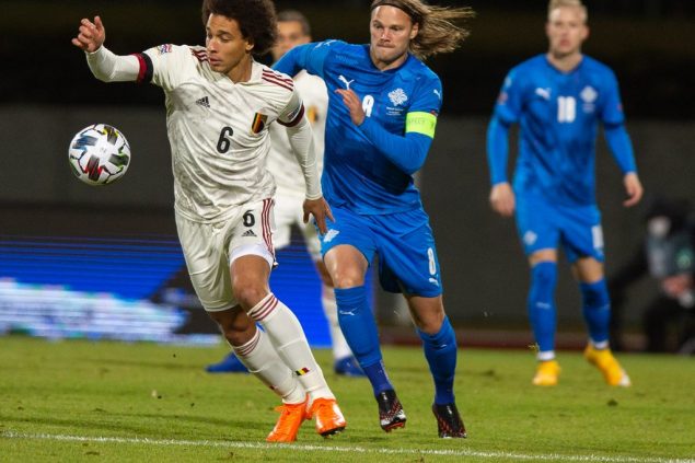 Belgium's Axel Witsel and Iceland's Birkir Bjarnason fight for the ball during the soccer match between the Belgian national soccer team Red Devils and Iceland, Wednesday 14 October 2020 in Reykjavik, Iceland, a European Cup 2020 qualification game. The Euro 2020 European Soccer Championships have been postponed to 2021, due to the ongoing coronavirus pandemic. BELGA PHOTO ARNI TORFASON