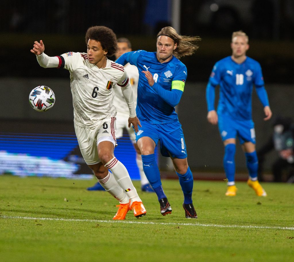 Belgium's Axel Witsel and Iceland's Birkir Bjarnason fight for the ball during the soccer match between the Belgian national soccer team Red Devils and Iceland, Wednesday 14 October 2020 in Reykjavik, Iceland, a European Cup 2020 qualification game. The Euro 2020 European Soccer Championships have been postponed to 2021, due to the ongoing coronavirus pandemic. BELGA PHOTO ARNI TORFASON