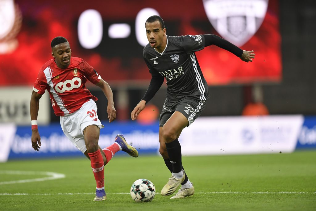 Standard's Michel Ange Balikwisha and Eupen's Senna Miangue fight for the ball during a soccer match between Standard de Liege and KAS Eupen, Saturday 21 November 2020 in Liege, on day 13 of the 'Jupiler Pro League' first division of the Belgian championship. BELGA PHOTO JOHN THYS