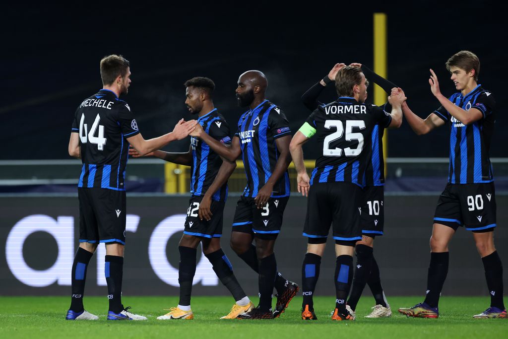 Club Brugge's Belgian midfielder Charles De Ketelaere (R) celebrates with teammates after scoring his team's first goal during the UEFA Champions League Group F football match between Club Brugge and Zenit St Petersburg at The Jan Breydel Stadium in Bruges on December 2, 2020. (Photo by Kenzo Tribouillard / AFP)