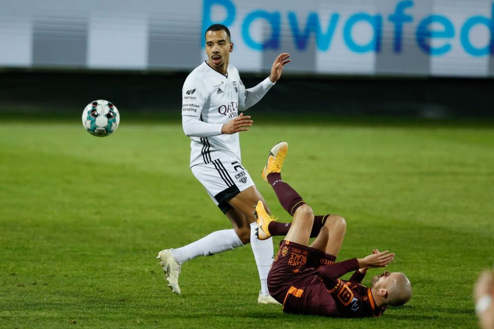 Eupen's Senna Miangue and Mechelen's Geoffrey Hairemans fight for the ball during a soccer match between KAS Eupen and KV Mechelen, Thursday 03 December 2020 in Eupen, a postponed game of day 10 of the 'Jupiler Pro League' first division of the Belgian championship. BELGA PHOTO BRUNO FAHY