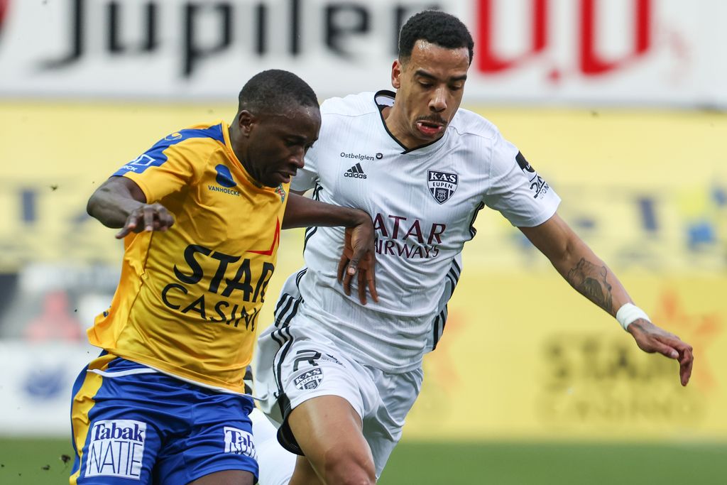 Waasland-Beveren's Serge Leuko and Eupen's Senna Miangue fight for the ball during a soccer match between Waasland-Beveren and KAS Eupen, Wednesday 17 February 2021 in Beveren-Waas, a postponed game of day 26 of the 'Jupiler Pro League' first division of the Belgian championship. The game was scheduled for last Saturday, but frost made the pitch unplayable. BELGA PHOTO DAVID PINTENS