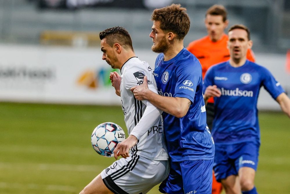 Eupen's Smail Prevljak and Gent's Dino Arslanagic fight for the ball during a soccer game between KAS Eupen and KAA Gent, Wednesday 03 March 2021 in Eupen, in the 1/4 finals of the 'Croky Cup' Belgian cup. BELGA PHOTO BRUNO FAHY