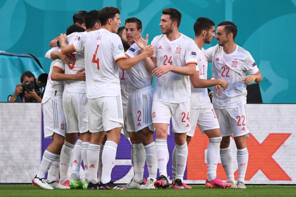 Spain's players celebrate a goal during the UEFA EURO 2020 quarter-final football match between Switzerland and Spain at the Saint Petersburg Stadium in Saint Petersburg on July 2, 2021. (Photo by Kirill KUDRYAVTSEV / POOL / AFP