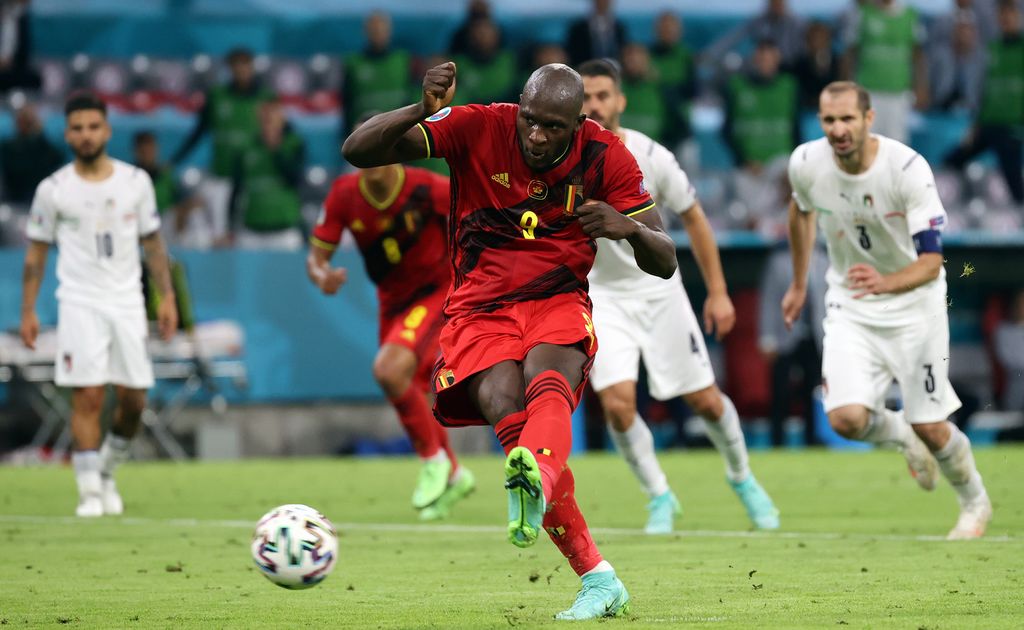 Belgium's Romelu Lukaku scores from penalty during the quarter-finals game of the Euro 2020 European Championship between the Belgian national soccer team Red Devils and Italy, in Munich, Germany, Friday 02 July 2021. BELGA PHOTO VIRGINIE LEFOUR