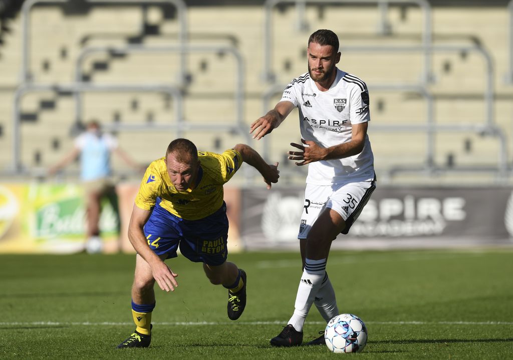 STVV's Christian Bruls and Eupen's Boris Lambert fight for the ball during a soccer match between KAS Eupen and Sint-Truidense VV, Saturday 14 August 2021 in Eupen, on day 4 of the 2021-2022 'Jupiler Pro League' first division of the Belgian championship. BELGA PHOTO JOHN THYS