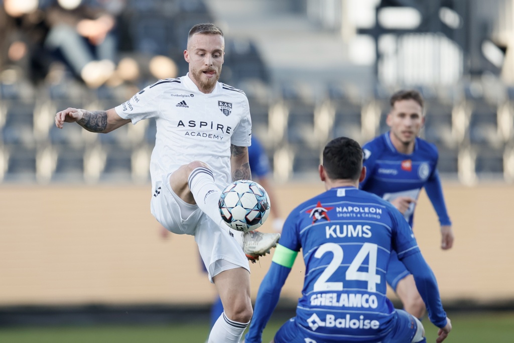 upen's James Jeggo and Gent's Sven Kums fight for the ball during a soccer match between KAS Eupen and KAA Gent, Saturday 12 February 2022 in Eupen, on day 27 of the 2021-2022 'Jupiler Pro League' first division of the Belgian championship. BELGA PHOTO BRUNO FAHY