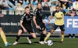 Eupen's James Jeggo, Eupen's Andreas Beck and Union's Loic Lapoussin fight for the ball during a soccer match between Royale Union Saint-Gilloise and KAS Eupen, Saturday 26 February 2022 in Brussels, on day 29 of the 2021-2022 'Jupiler Pro League' first division of the Belgian championship. BELGA PHOTO BRUNO FAHY