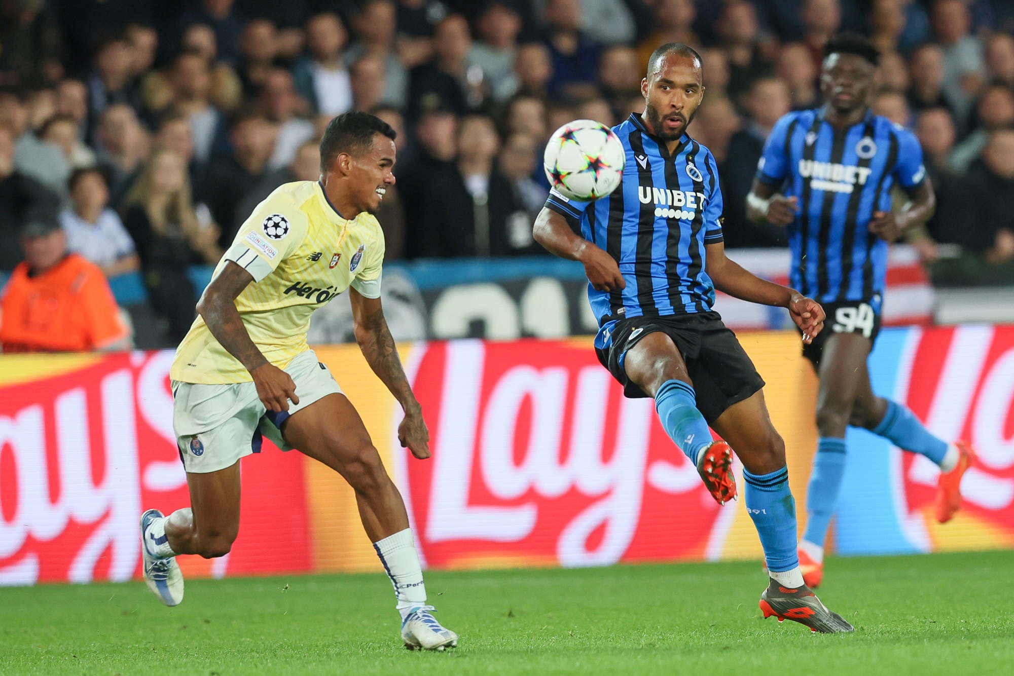 Porto's Galeno and Club's Denis Odoi fight for the ball during the match between Belgian soccer team Club Brugge KV and Portuguese FC Porto , Wednesday 26 October 2022 in Brugge, Belgium, the fifth game in the UEFA Champions League group stage. BELGA PHOTO BRUNO FAHY