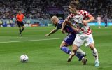 Croatia's midfielder #10 Luka Modric fights for the ball with Japan's forward #25 Daizen Maeda during the Qatar 2022 World Cup round of 16 football match between Japan and Croatia at the Al-Janoub Stadium in Al-Wakrah, south of Doha on December 5, 2022. (Photo by ADRIAN DENNIS / AFP)
