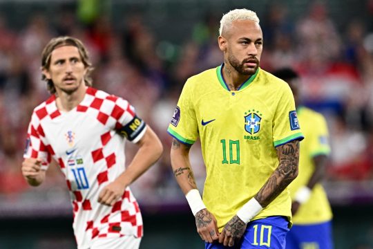 Brazil's forward #10 Neymar and Croatia's midfielder #10 Luka Modric look on during the Qatar 2022 World Cup quarter-final football match between Croatia and Brazil at Education City Stadium in Al-Rayyan, west of Doha, on December 9, 2022. (Photo by GABRIEL BOUYS / AFP)