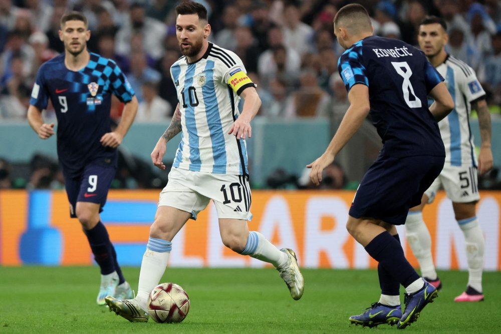 Argentina's forward #10 Lionel Messi (C) is challenged by Croatia's midfielder #08 Mateo Kovacic (R) and Croatia's forward #09 Andrej Kramaric during the Qatar 2022 World Cup football semi-final match between Argentina and Croatia at Lusail Stadium in Lusail, north of Doha on December 13, 2022. (Photo by JACK GUEZ / AFP)