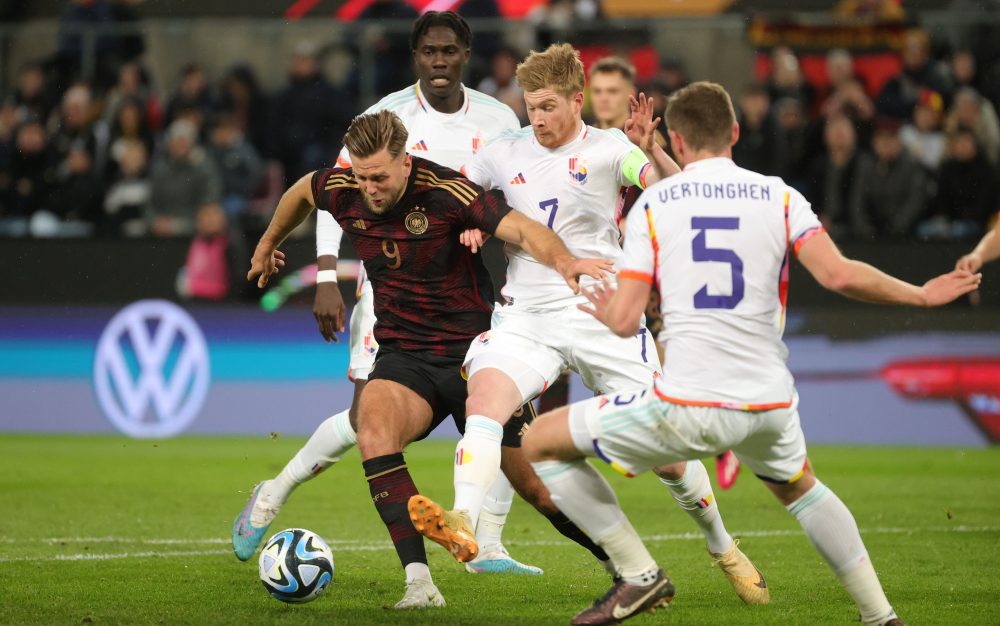 erman Niclas Fullkrug and Belgium's captain Kevin De Bruyne fight for the ball during a friendly game between the German national soccer team and Belgian national soccer team Red Devils, in Koln, Germany, Tuesday 28 March 2023. BELGA PHOTO VIRGINIE LEFOUR