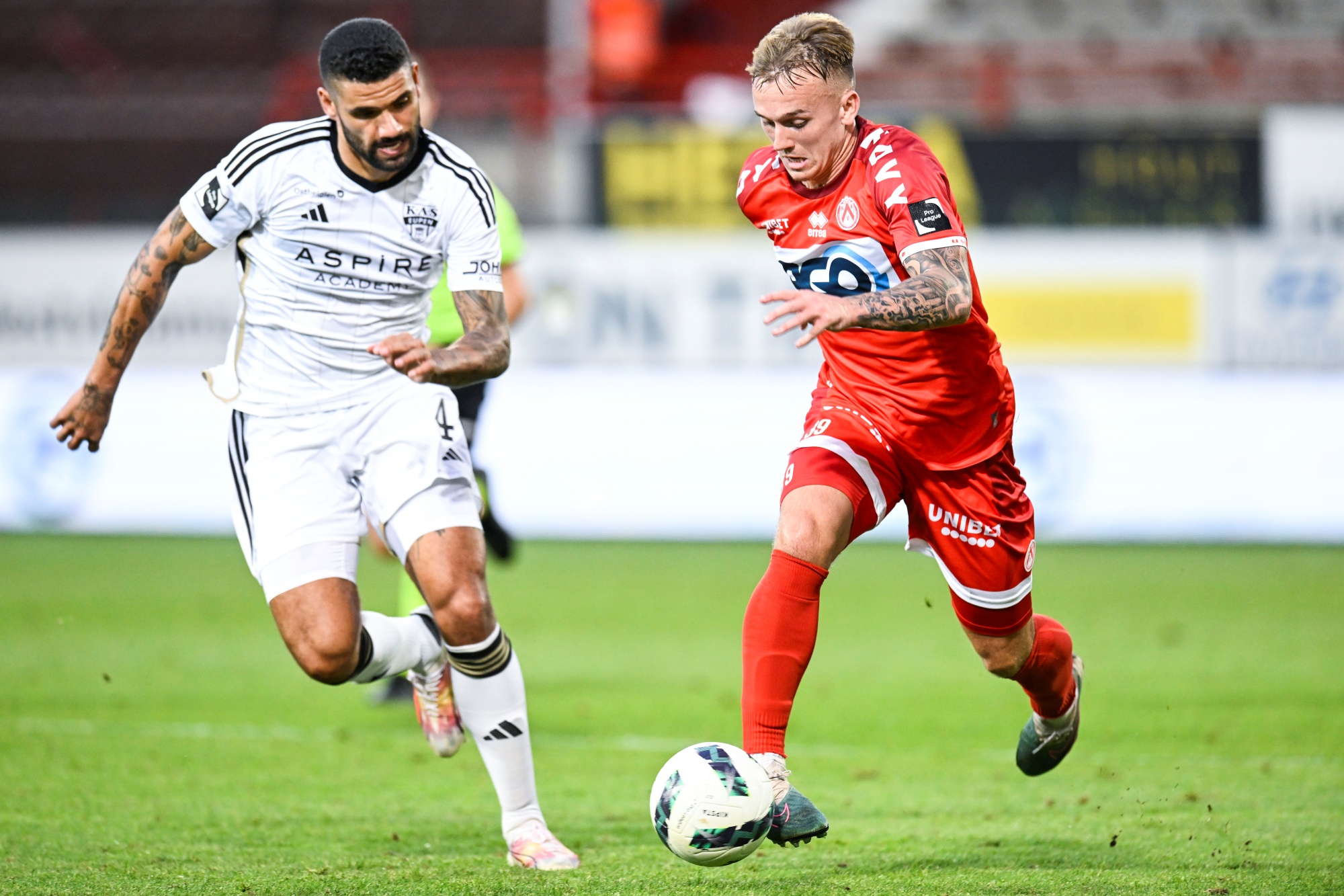 Eupen's Victor Palsson and Kortrijk's Isaak Davies pictured in action during a soccer match between KV Kortrijk and KAS Eupen, Sunday 20 August 2023 in Kortrijk, on day 4/30 of the 2023-2024 'Jupiler Pro League' first division of the Belgian championship. BELGA PHOTO TOM GOYVAERTS