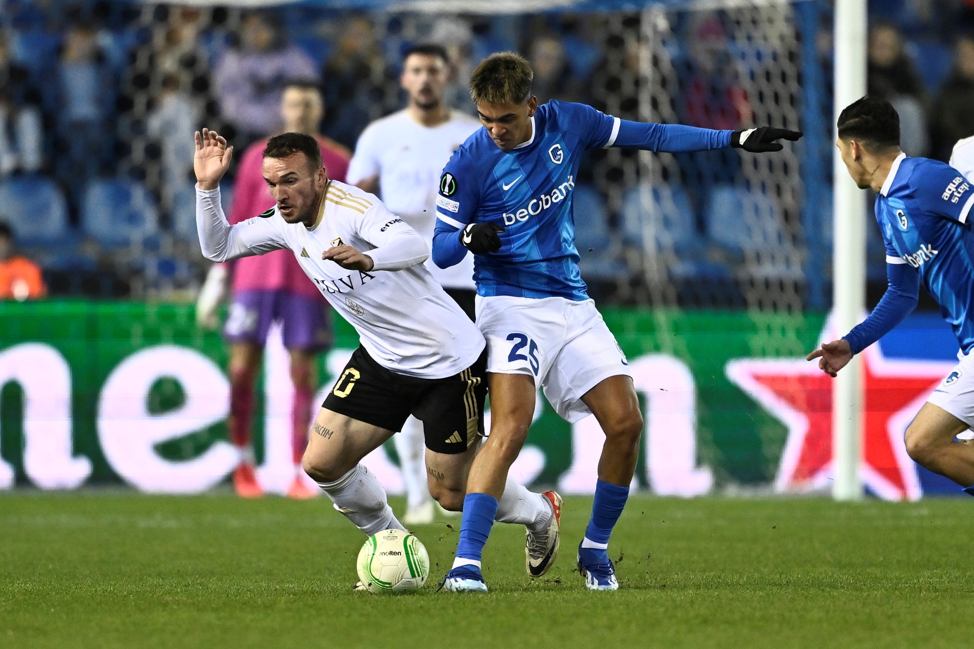 Cukaricki's Dorde Ivanovic and Genk's Matias Galarza fight for the ball during a game between Belgian soccer team KRC Genk and Serbian club FK Cukaricki, on Thursday 14 December 2023 in Genk, for the sixth and last day of the group phase of the UEFA Conference League competition, in group F. BELGA PHOTO JOHAN EYCKENS