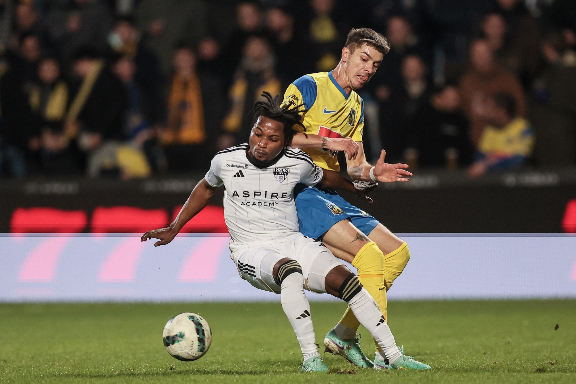 Eupen's Isaac Nuhu and Westerlo's Roman Neustadter fight for the ball during a soccer match between KVC Westerlo and KAS Eupen, Friday 15 December 2023 in Westerlo, on day 18/30 of the 2023-2024 'Jupiler Pro League' first division of the Belgian championship. BELGA PHOTO BRUNO FAHY