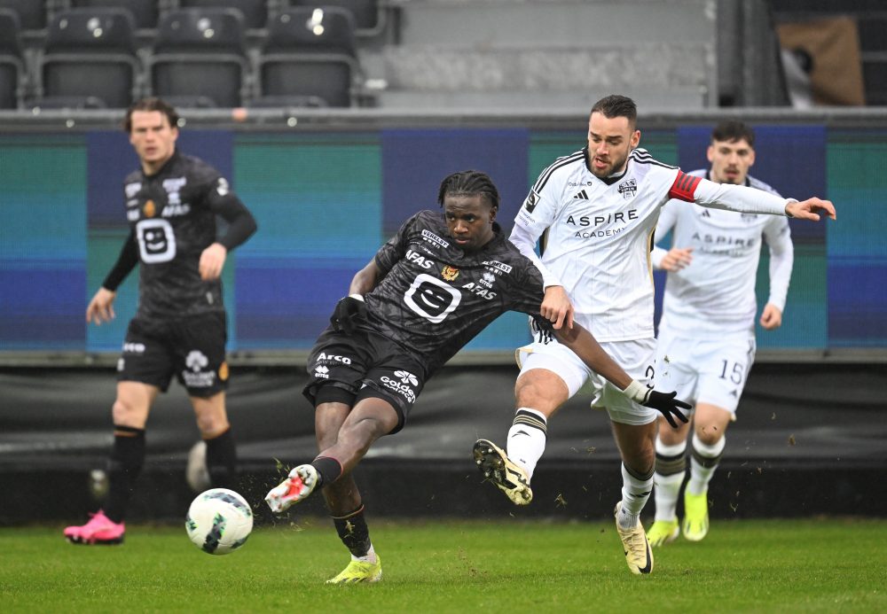 Mechelen's Ngal'ayel Mukau and Eupen's Boris Lambert fight for the ball during a soccer match between KAS Eupen and KV Mechelen, Sunday 04 February 2024 in Eupen, on day 24 of the 2023-2024 'Jupiler Pro League' first division of the Belgian championship. BELGA PHOTO JOHN THYS