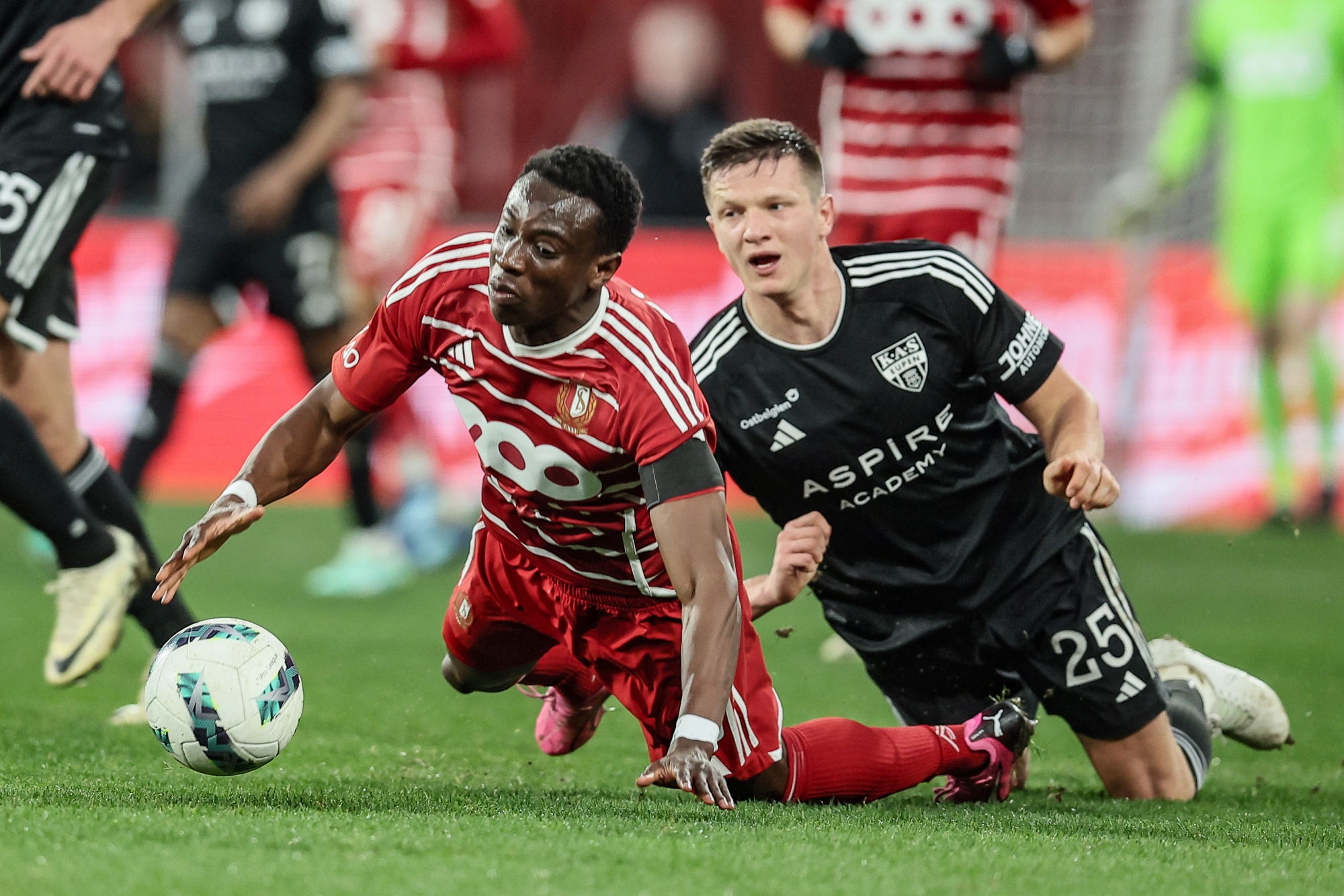 Standard's Kelvin Yeboah and Eupen's Aleksander Filin fight for the ball during a soccer match between Standard de Liege and KAS Eupen, Saturday 16 March 2024 in Liege, on the last day (30/30) of the 2023-2024 season of the 'Jupiler Pro League' first division of the Belgian championship. BELGA PHOTO BRUNO FAHY