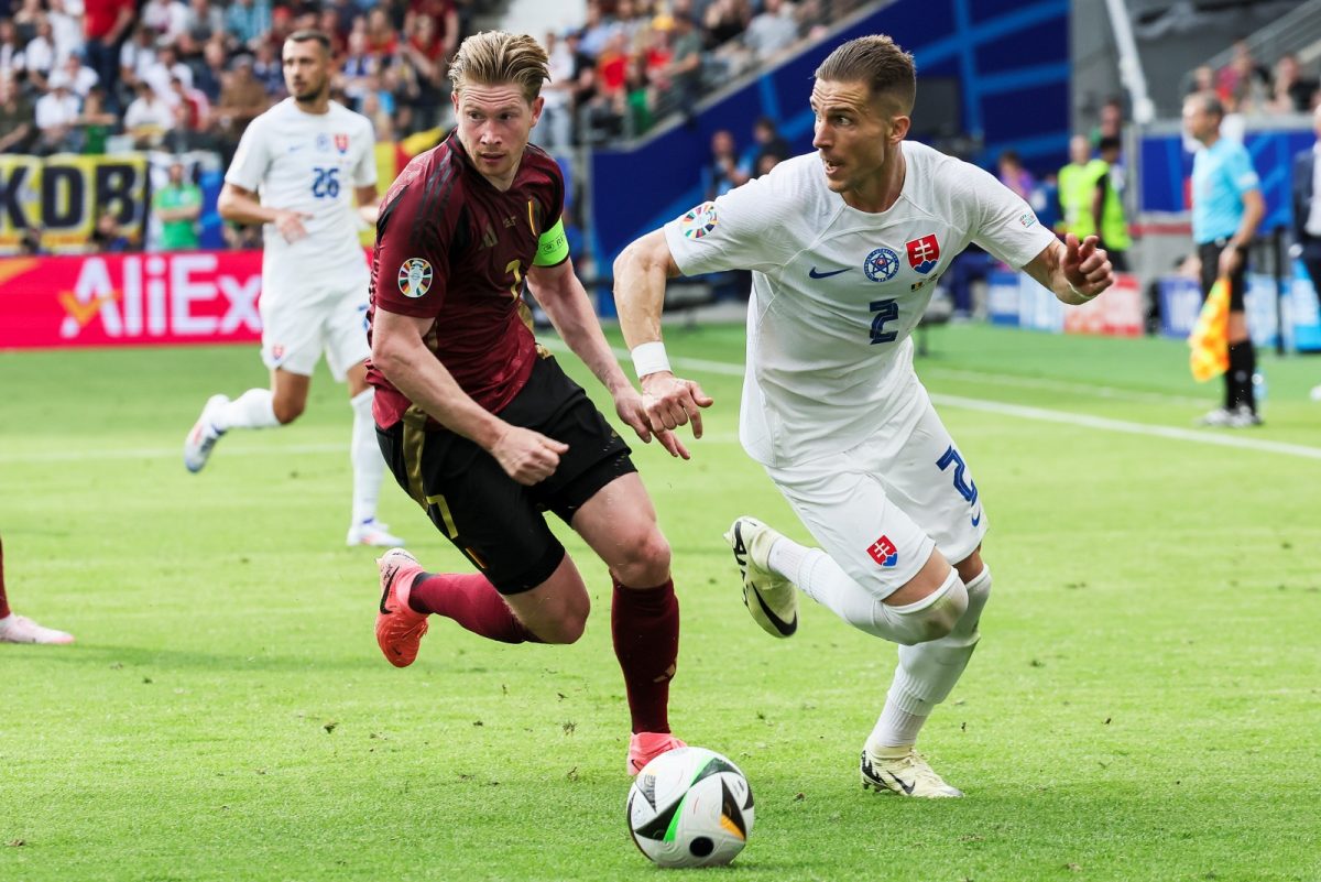 Belgium's Kevin De Bruyne and Slovakia's Peter Pekarik fight for the ball during a soccer game between Belgian national soccer team Red Devils and Slovakia, Monday 17 June 2024 in Frankfurt Am Main, Germany, the first match in the group stage of the UEFA Euro 2024 European championships. BELGA PHOTO BRUNO FAHY