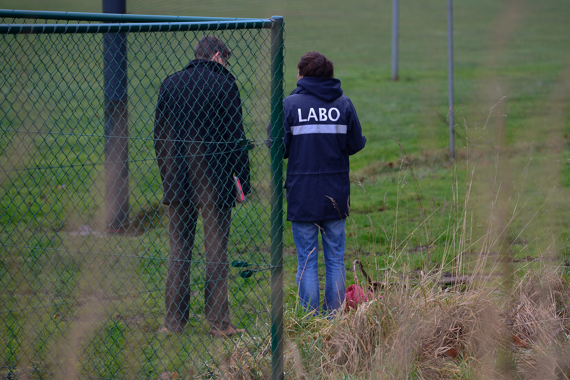 Ermittler nach einem Mord in Wommelgem 2014