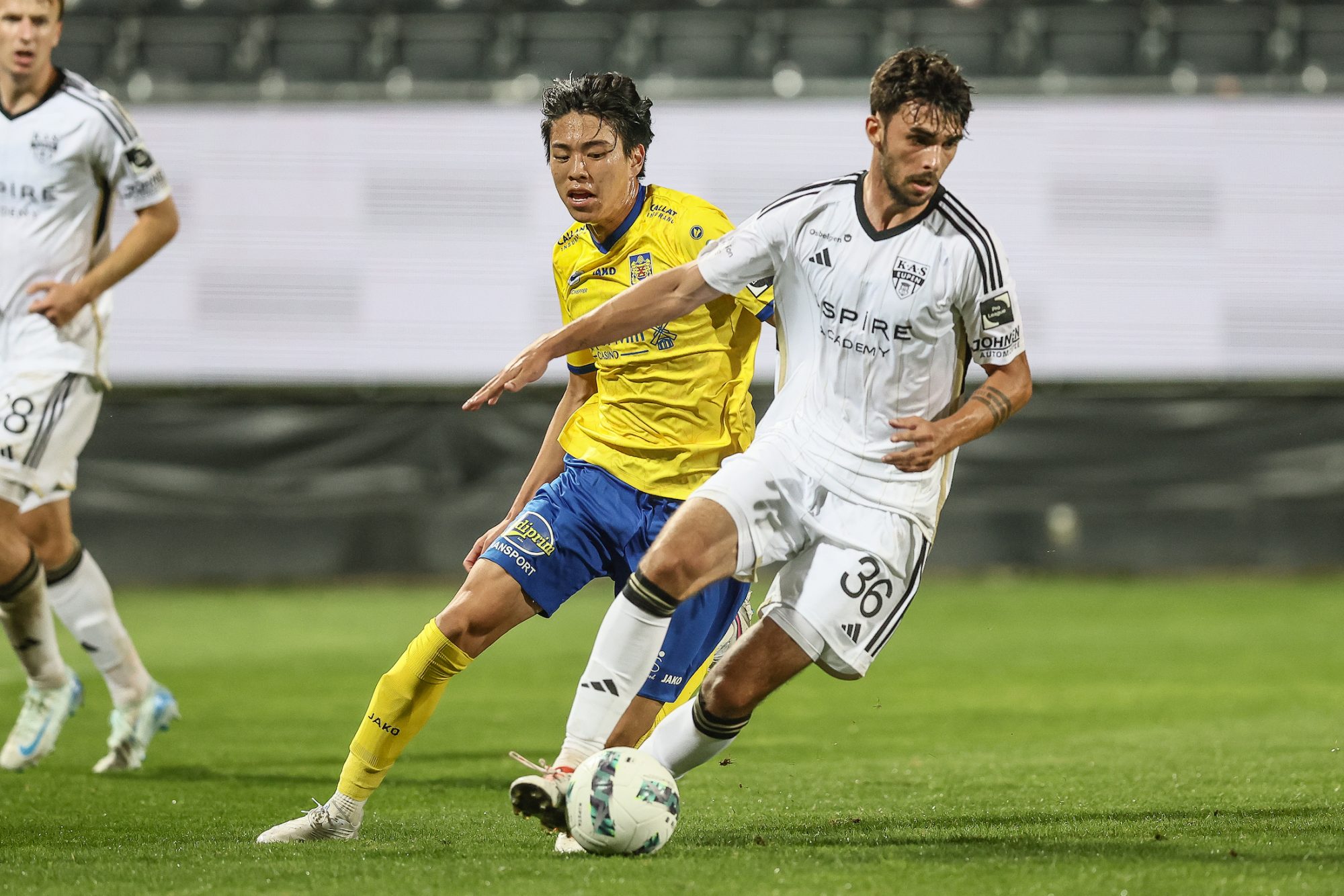 Beveren's Yutaka Michiwaki and Eupen's Luca Chavet fight for the ball during a soccer match between KAS Eupen and SK Beveren, in Eupen, on day 2 of the 2024-2025 'Challenger Pro League' 1B second division of the Belgian championship, Friday 23 August 2024. BELGA PHOTO BRUNO FAHY