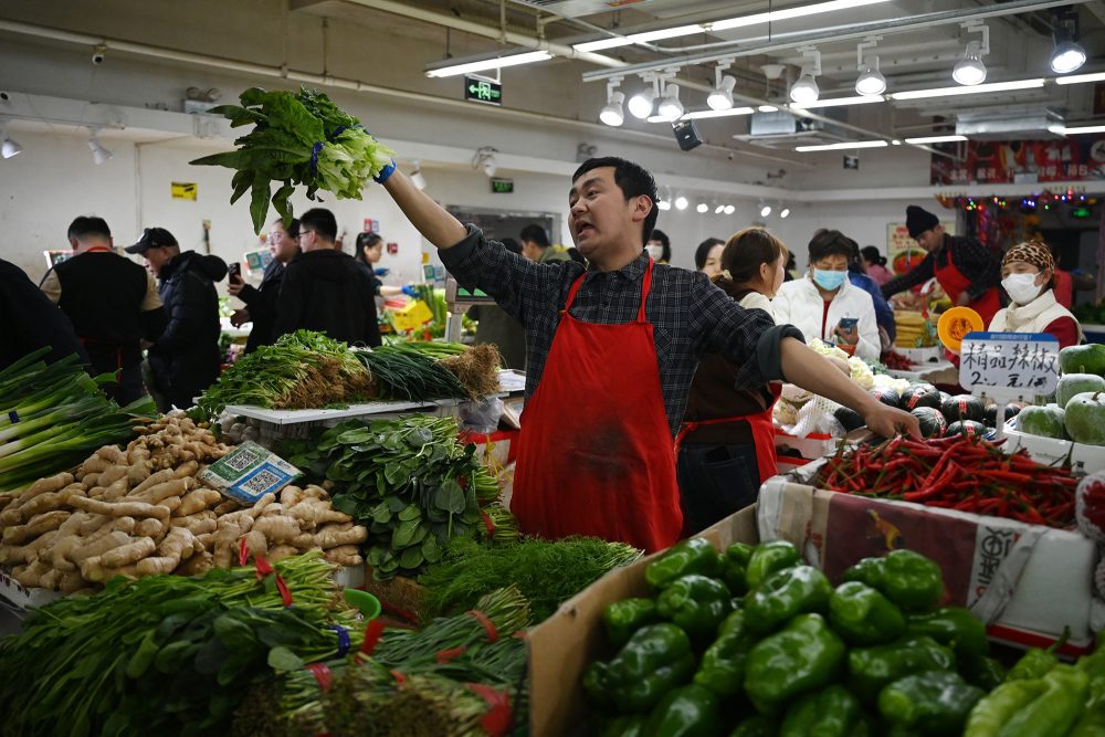 Gemüseverkäufer auf einem Markt in Peking