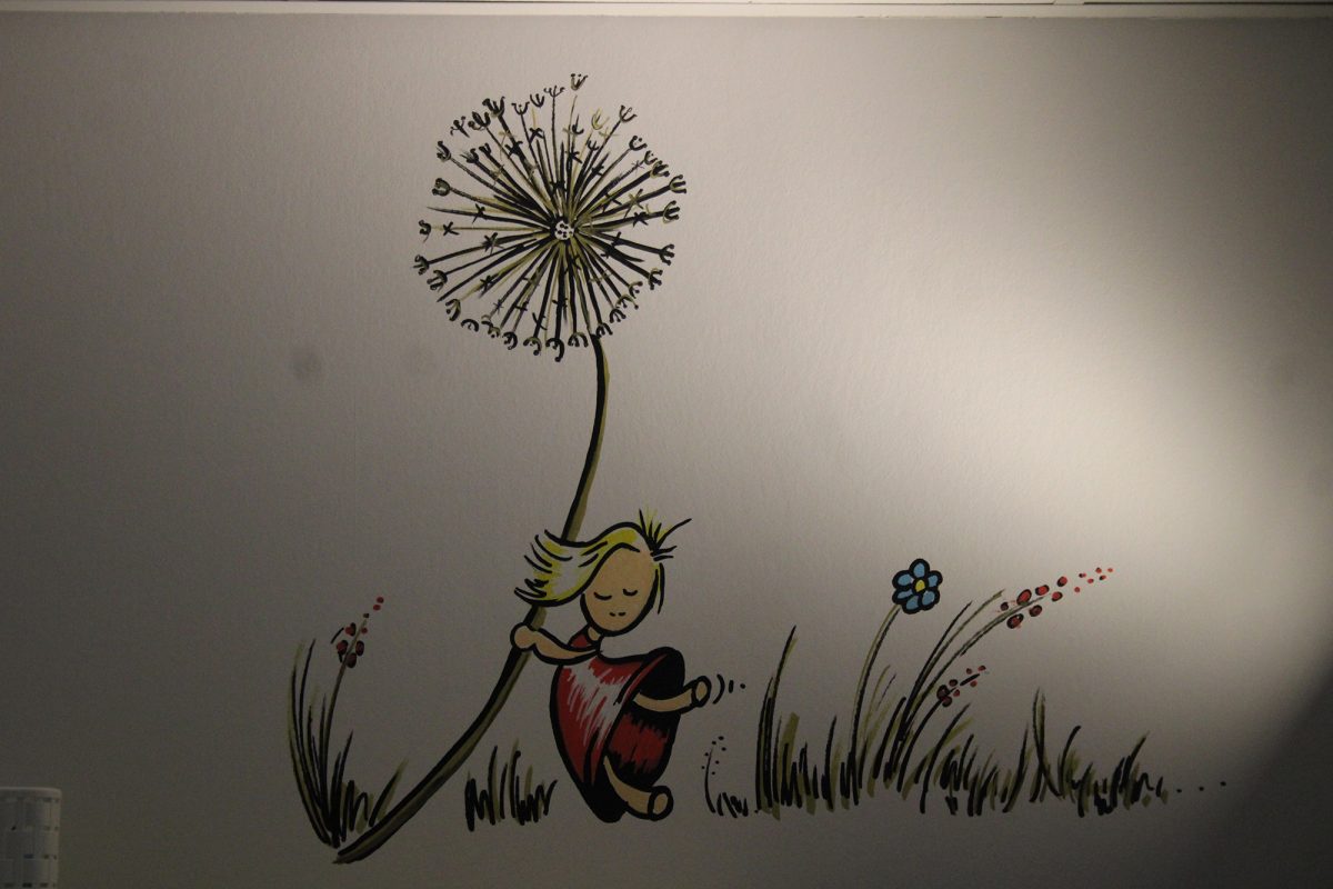 Wandzeichnung mit einem kleinen Mädchen, das eine Pusteblume umklammert